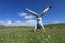 Woman doing a handstand in a mountain peak