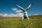 Woman doing a handstand in a mountain peak