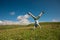 Woman doing a handstand in a mountain peak