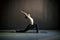 Woman doing hatha yoga asana Anjaneyasana or low crescent lunge pose