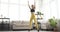 Woman doing jumping jacks exercise at home