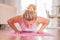 Woman doing push-ups on yoga mat at home. Fitness girl doing pushups on exercise mat