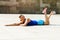 Woman doing pushups outdoor. Resting after exercise.