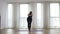 Woman doing stretching exercise in yoga studio