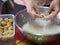 Woman doing Stuffed Dough Pyramid Dessert, Stuffed Dough Pyramid, year cake, Chinese New Yearâ€™s cake, dessert Made with