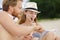 Woman doing sudoku on beach