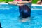 Woman Doing Water Aerobics Outdoor in a Swimming Pool