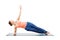 Woman doing yoga asana Vasisthasana - side plank pose