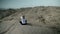 Woman doing yoga in empty Safari landscape