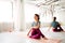 Woman doing yoga exercise at studio