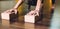 Woman doing yoga exercises using bricks for yoga