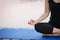 Woman doing yoga in lotus position outdoors near the river on a wooden pier in the morning. Healthy lifestyle concept. Morning