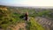 Woman doing yoga and meditates on the top of the mountain. Harmony with nature