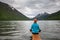 Woman is doing yoga at Multinskoe lake