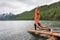 Woman is doing yoga at Multinskoe lake