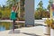 Woman doing yoga outdoors in dancer pose