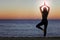 Woman doing yoga positions and meditating