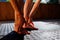 woman doing yoga on the street. Fit woman doing stretching exercises. hands and feet close-up