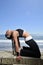 Woman doing yoga stretch on beach