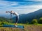 Woman doing yoga Sun Salutation Surya Namaskar