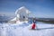 Woman downhill skiing in ski resort area in Lapland Finland