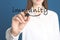 Woman drawing line under word Immunity on transparent board, closeup