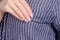 Woman in dress blue striped seam fabric macro pocket
