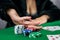 woman in dress wins a game of blackjack and is happy with all the chips after playing poker.