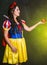 Woman dressed as fairytale character holds Radioactive atomic nuclear ionizing radiation danger warning symbol on apple