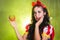 Woman dressed as fairytale character holds Radioactive atomic nuclear ionizing radiation danger warning symbol on apple