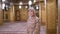 Woman Dressed in a Nun`s Robe Stands Inside an Islamic Temple. Egypt