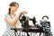 Woman dressmaker pin up style using antique sewing manual machine