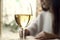 Woman drink white wine with friend in restaurant or a cafe