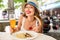 Woman drinking a beer in Bavaria