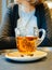 Woman drinking best tasty hot tea in cozy cafe