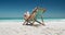 Woman drinking cocktail on deck chair on the beach