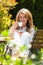 Woman drinking coffee at breakfast in the garden