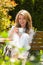 Woman drinking coffee at breakfast in the garden