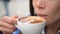 Woman Drinking Coffee - Cappuccino with coffee latte art in cafe close up