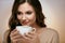 Woman Drinking Coffee. Female Drinking Hot Beverage.