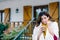 Woman drinking coffee outside home on freezing cold autumn