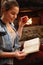 Woman drinking coffee and readings book in mountain house