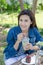 Woman drinking ice greentea and cake