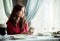 Woman drinking latte in a cafe. Vintage color tone