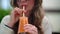Woman drinking an orange juice