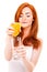 Woman drinking orange juice smiling