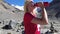 woman drinking water by Morteratsch glacier