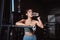 Woman drinking water recovery health exercise workout in gym fitness breaking relax after training sport with kettlebell,