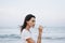 Woman drinking wine on beach