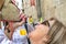 Woman drinking wine in a traditional way at caballos Del Vino in Caravaca de la Cruz, Spain on May 2nd 2019